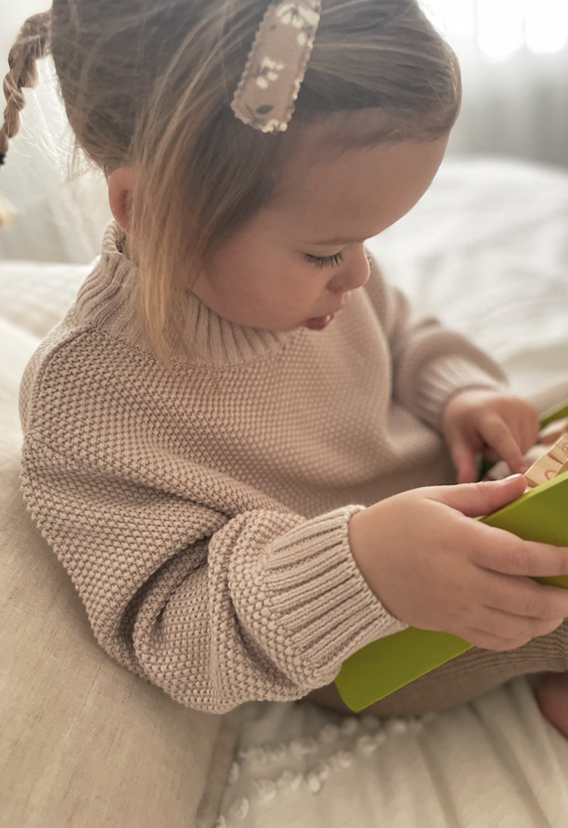 Little girl in organic moss chunky knit taupe jumper