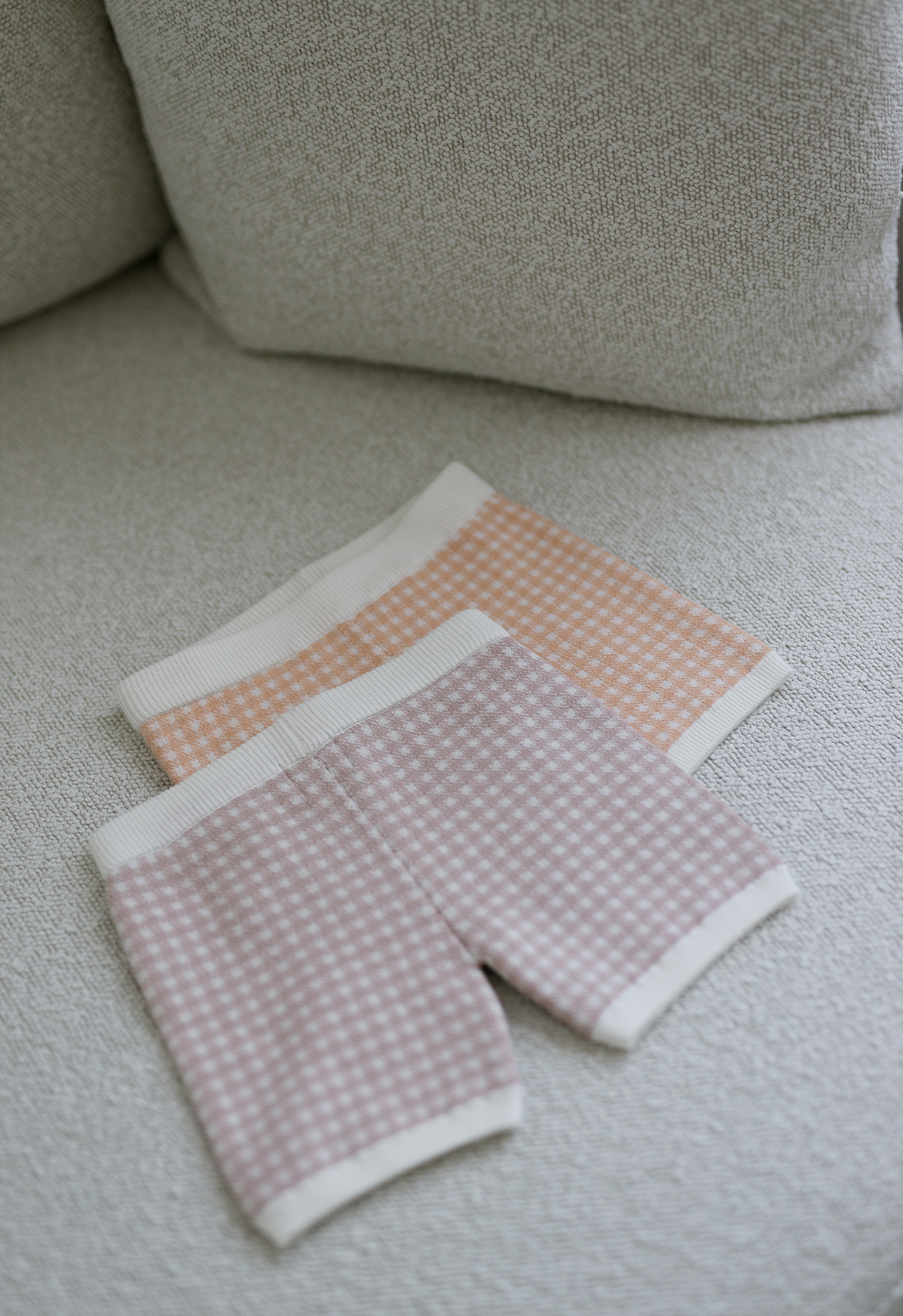 mauve and peach gingham shorts flay lay