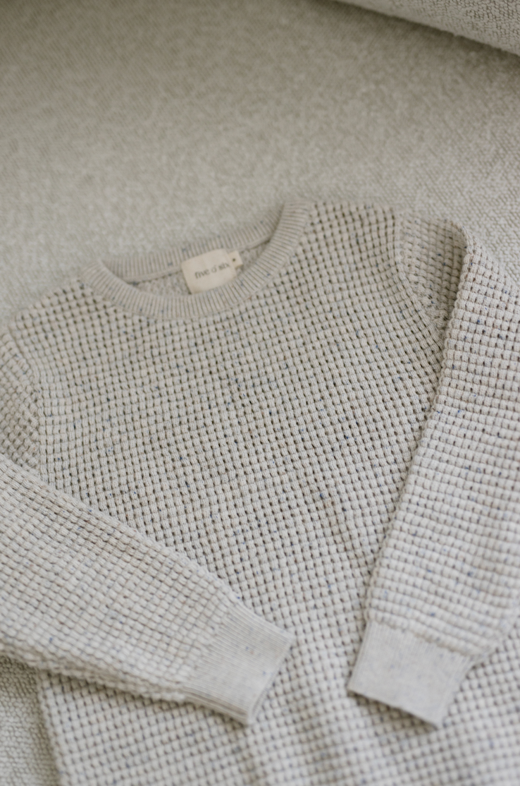 close up of waffle specked jumper