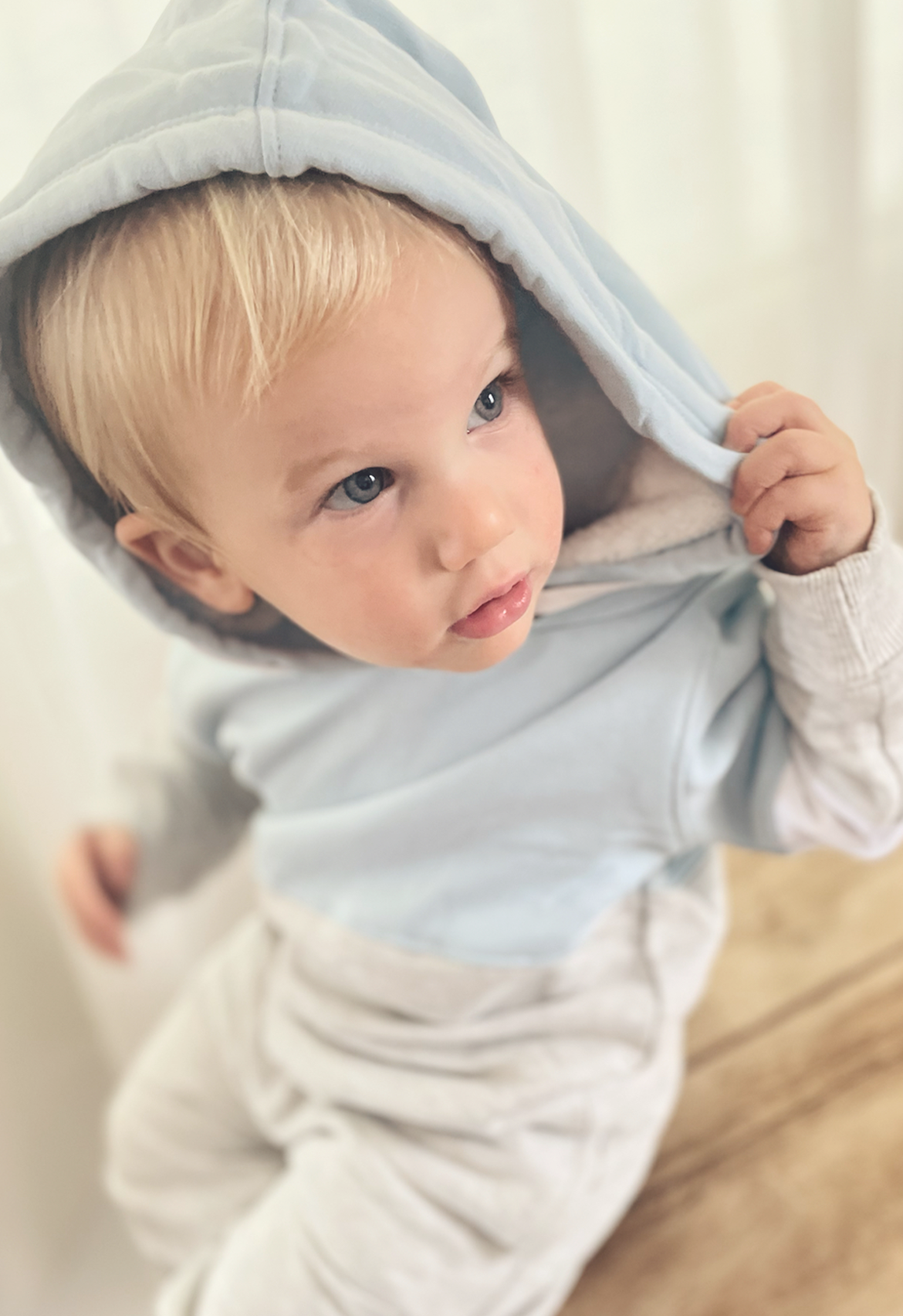 baby boy wearing blue block hooded jumper