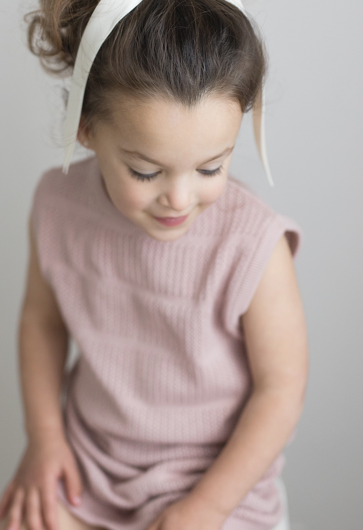 girl sitting in mauve dress crochet 