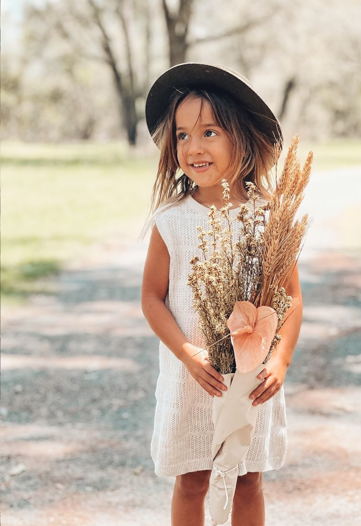 girls standing with flowers in pointelle dress