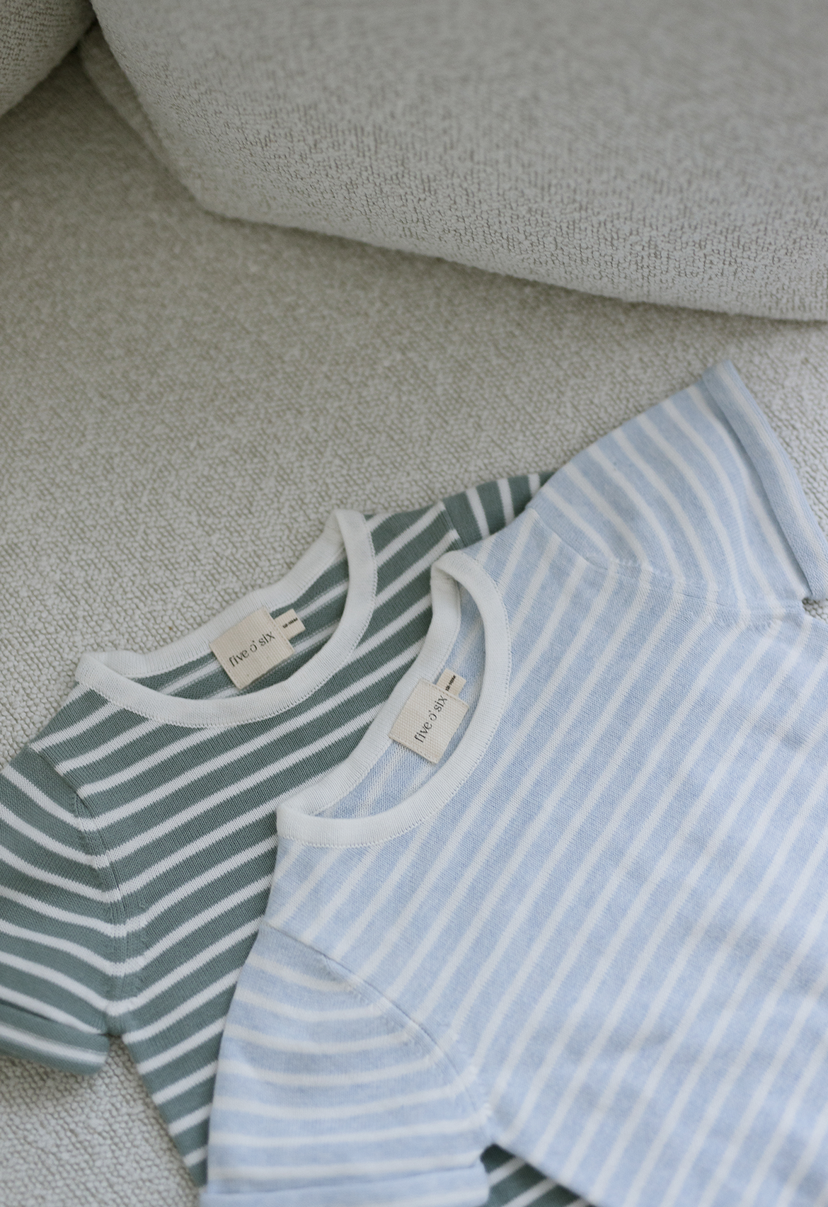flat lay of knit t-shirts blue and teal